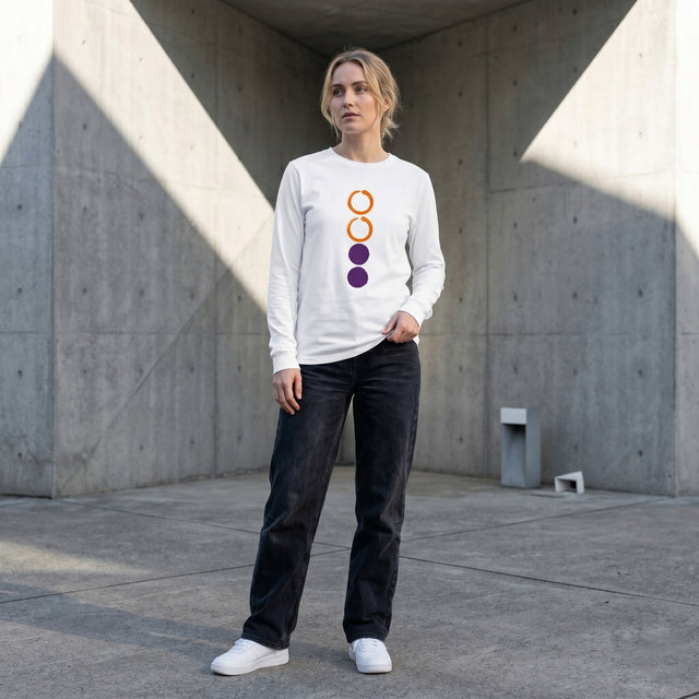 Person wearing a white sweatshirt with colorful design in an urban setting
