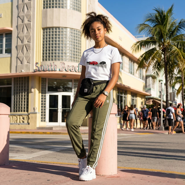 A girl wearing a white t-shirt with an automobile graphic