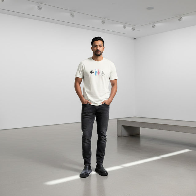 Man wearing a white t-shirt with a graphic design in a minimalistic room.