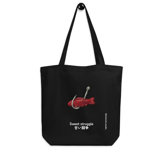 Eco tote bag featuring a minimalist illustration of a metal fish hook snagging a red Swedish Fish gummy candy.