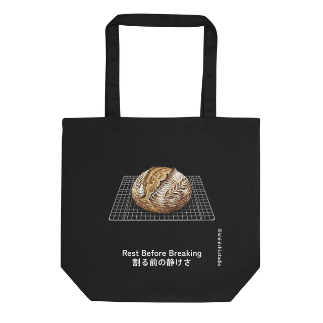Eco Tote Bag displaying a cross-hatched illustration of a scored sourdough loaf on a cooling rack.