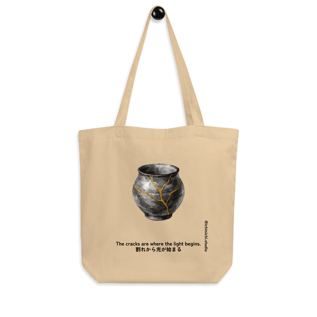 Minimalist drawing of ceramic surface repaired with gold lines in the Kintsugi style, elegant Japanese Tote Bag design.
