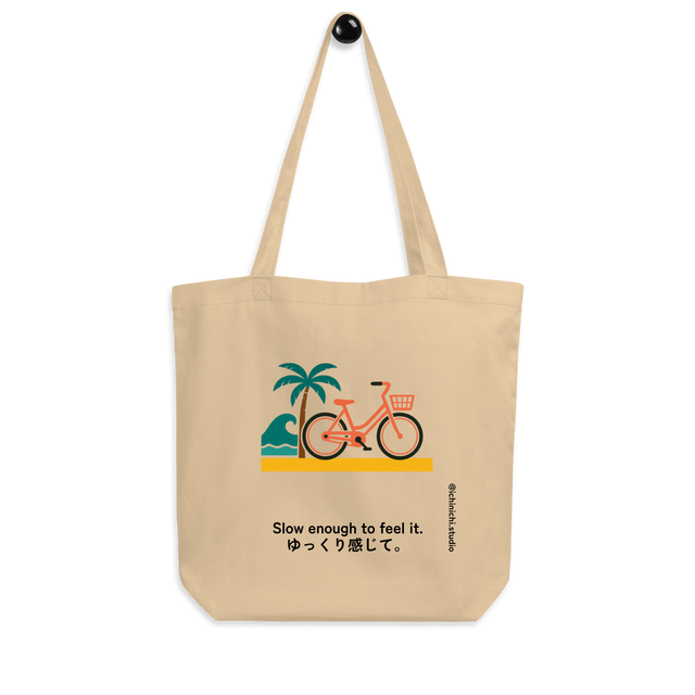 Minimalist Eco Tote Bag design showing a bicycle and palm tree with ocean waves in bright Miami-inspired colors.