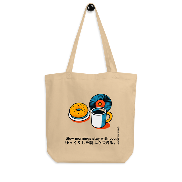 Minimal illustration of bagels, coffee, and vinyl arranged together on an Eco Tote Bag design.