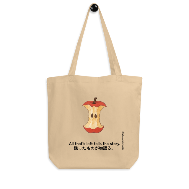 Minimal illustration of a bitten apple core on an eco tote bag design.