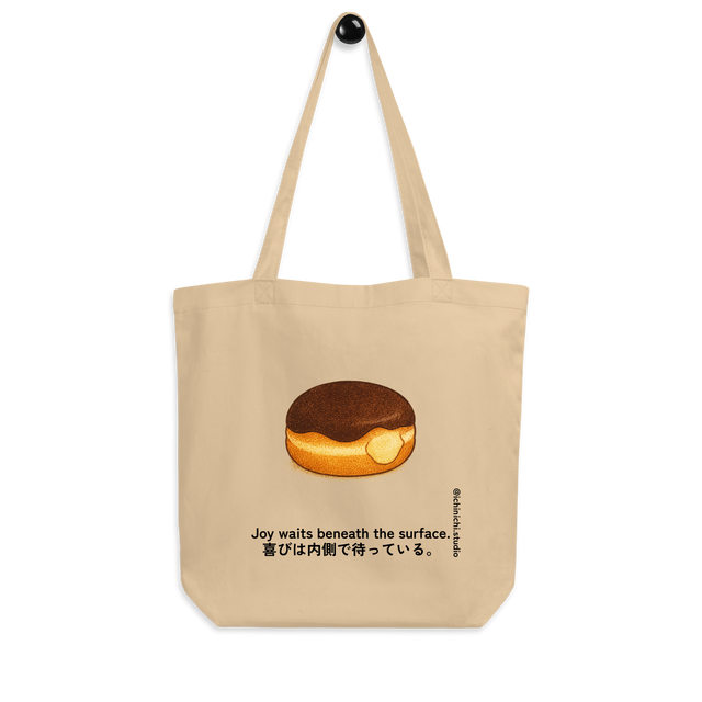 Minimal illustration of a Boston cream donut with custard filling on a tote bag design.