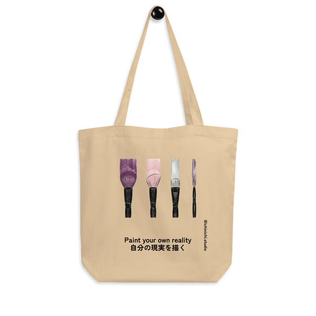 Four makeup brushes illustrating trails of purple, pink, and silver on a minimalist Tote Bag.