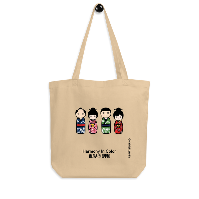 Illustration of four colorful Japanese kokeshi dolls arranged in two pairs on a Tote Bag.