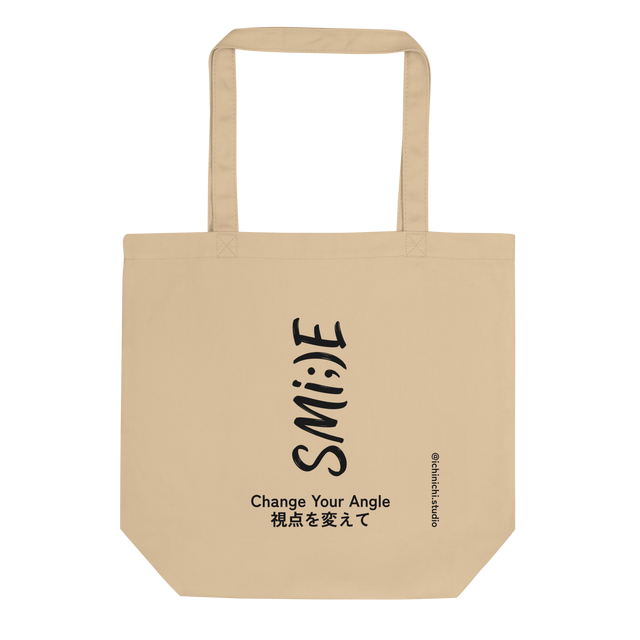 Black ink vertical typographic smile design on canvas tote bag.
