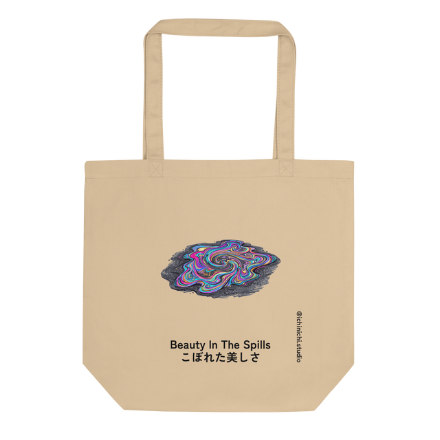 An Eco Tote Bag featuring a graphic of a swirling, iridescent oil slick on dark asphalt painted with clean lines.