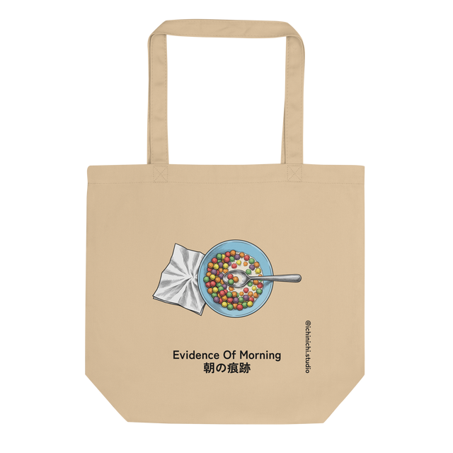 Eco Tote Bag featuring a cross-hatch illustration of a light blue bowl of colorful cereal and a crumpled napkin from above.