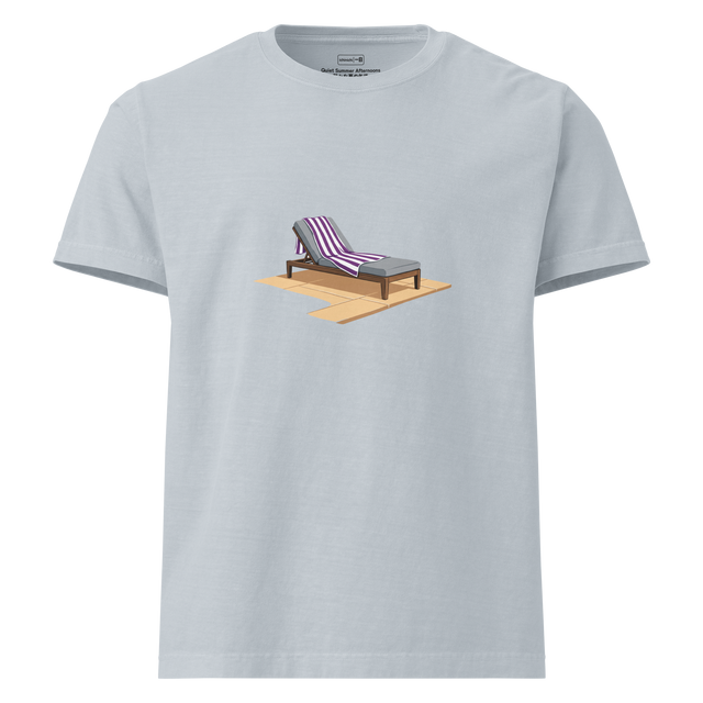 An oversize t-shirt featuring a painted graphic of a lounge chair with a striped towel next to a pool.