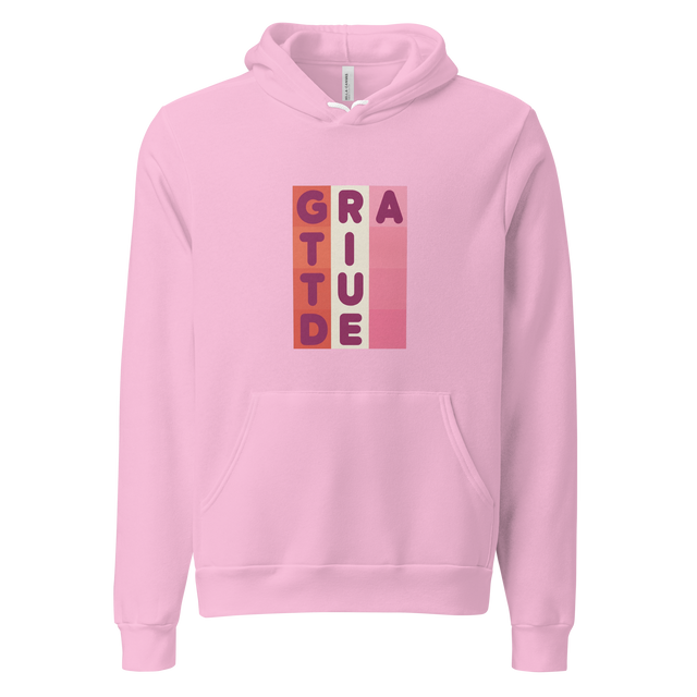 Soft 3D pillowed letters spelling gratitude arranged in a geometric color block grid on a Unisex Pullover Hoodie.