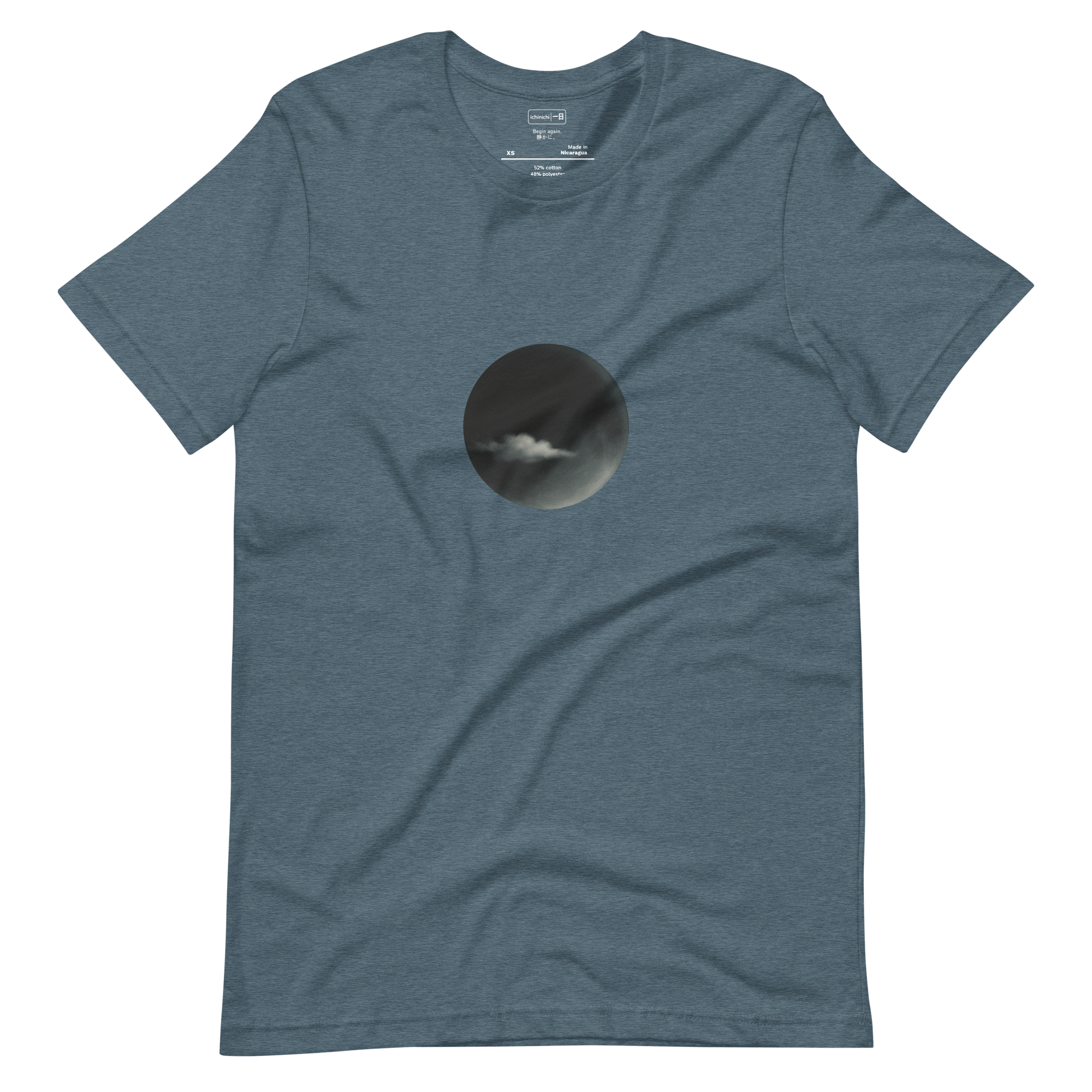 A minimalist graphic of a black moon centered on a heather black shirt