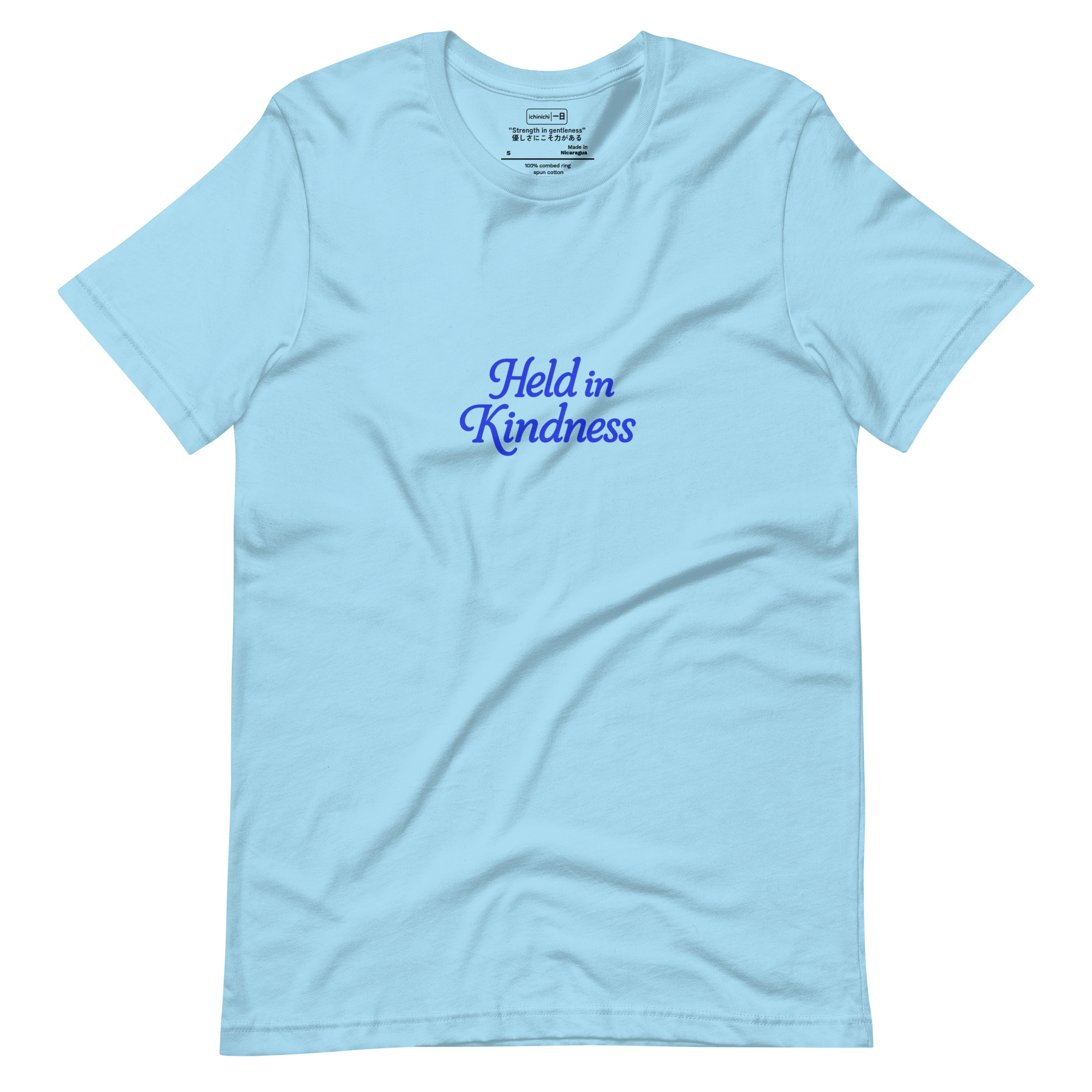 Minimal text design reading “Held in Kindness” in simple, reflective typography.