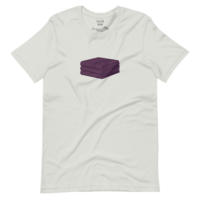 Minimalist illustration of a stack of folded waffle-weave towels, centered on a Short Sleeve T-Shirt.