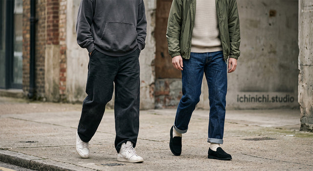 Minimalist street style image focusing on the balance of oversized hoodie and wide pants.