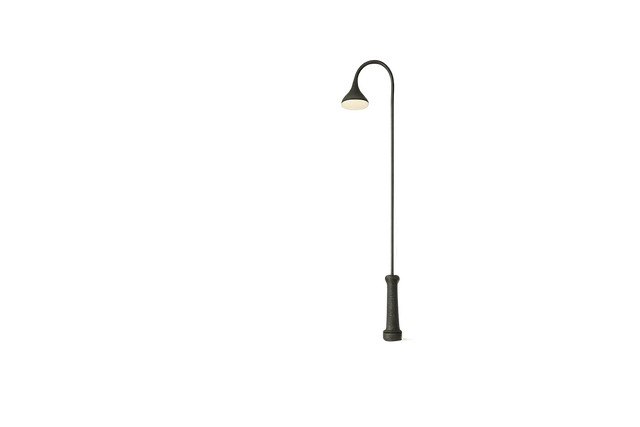 Minimalist empty street with single glowing streetlight at night.