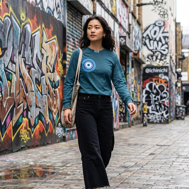 Woman walking down a graffiti-covered alleyway