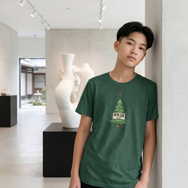 Person wearing a green t-shirt with a graphic design in a modern indoor setting