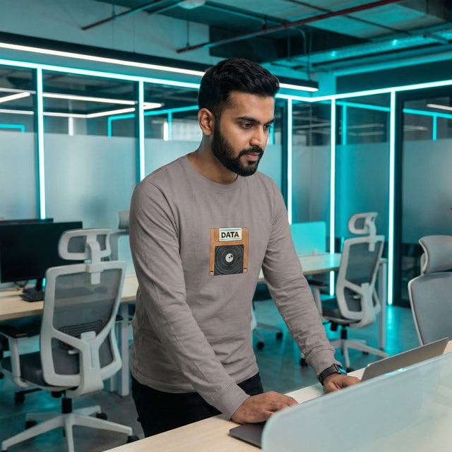 Man working on a laptop in a modern office setting