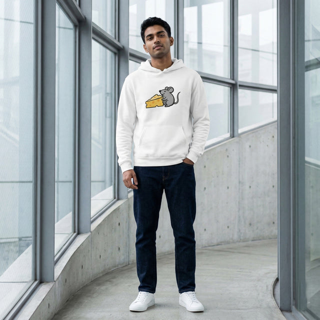 Man wearing a white hoodie with a graphic design in a modern indoor setting