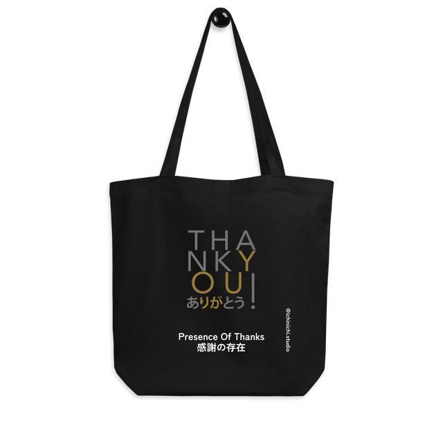 Minimalist typography design featuring Presence of Thanks in gold and silver on an Eco Tote Bag.