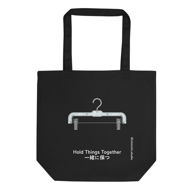 A minimalist simple line drawing of a plastic pants hanger with metal clips on an Eco Tote Bag.