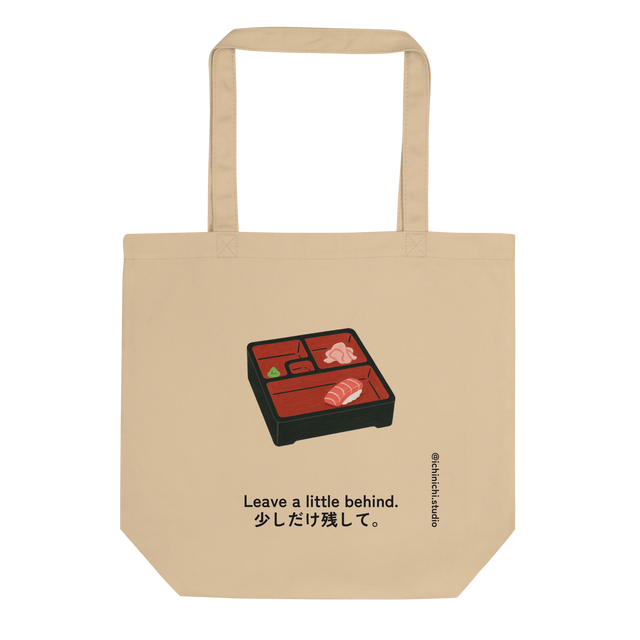 Minimalist Eco Tote Bag design showing a bento box with one last piece of sushi, expressing calm and mindful simplicity.
