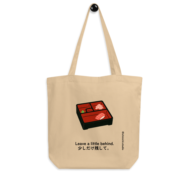 Minimalist Eco Tote Bag design showing a bento box with one last piece of sushi, expressing calm and mindful simplicity.

