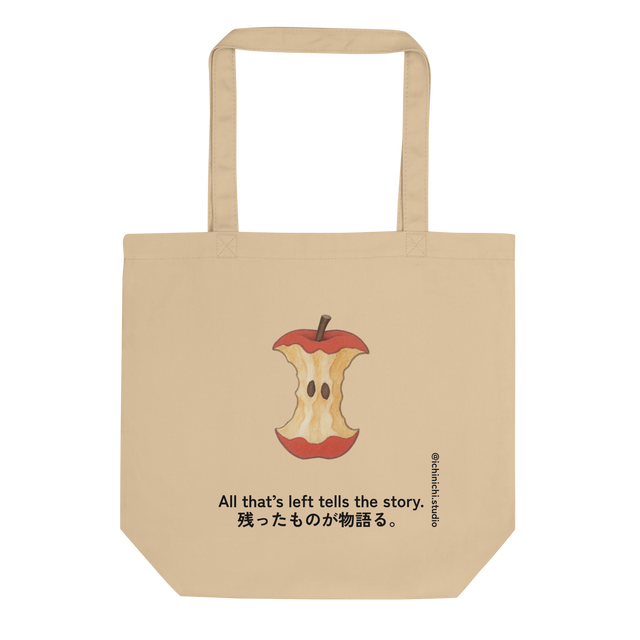 Minimal illustration of a bitten apple core on an eco tote bag design.
