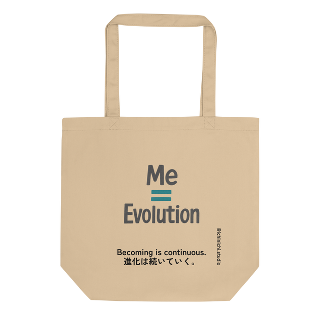Minimal text-based design reading “Me = Evolution” on a tote bag.
