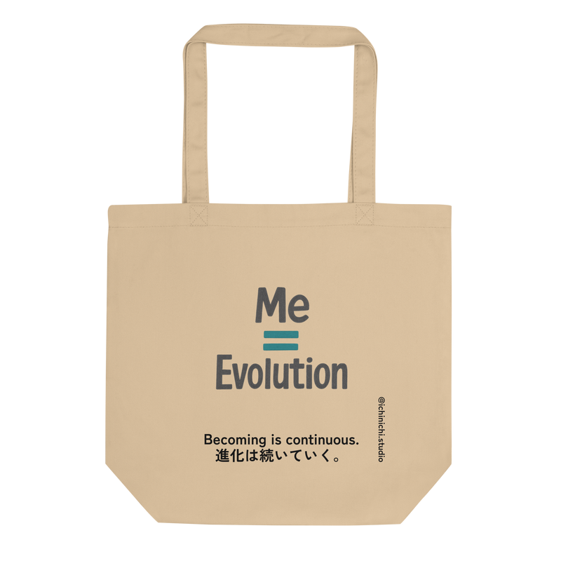 Minimal text-based design reading “Me = Evolution” on a tote bag.
