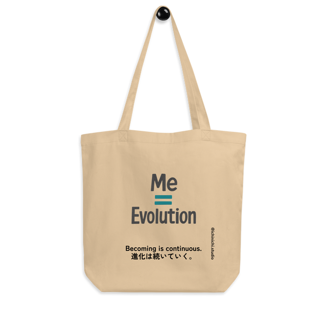 Minimal text-based design reading “Me = Evolution” on a tote bag.
