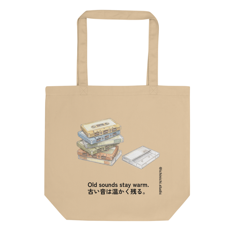Minimal illustration of a stack of cassette tapes on an eco tote bag design.

