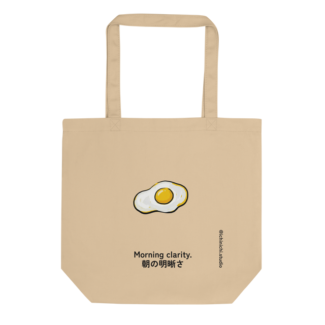 Graphic pop art illustration of fried eggs with bold outlines and flat colors on a white background for a tote bag.
