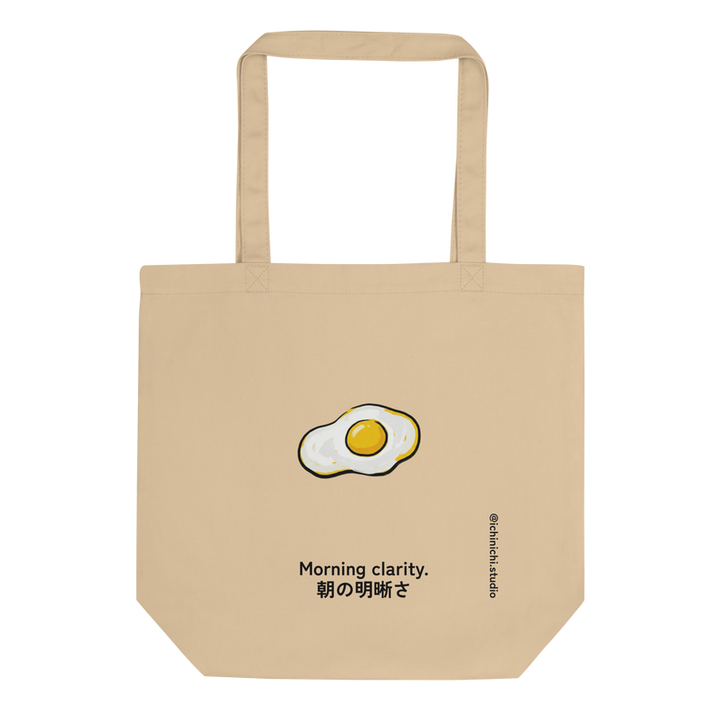 Graphic pop art illustration of fried eggs with bold outlines and flat colors on a white background for a tote bag.