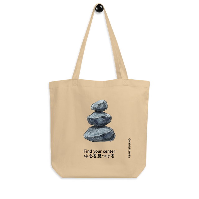 Minimalist line drawing of three stones stacked vertically in perfect balance on a Tote Bag.
