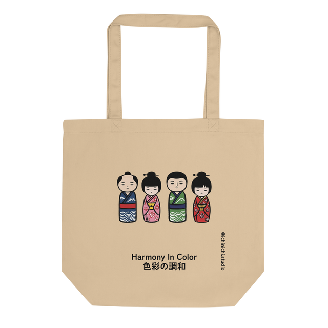 Illustration of four colorful Japanese kokeshi dolls arranged in two pairs on a Tote Bag.