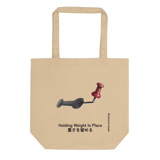 Descriptive graphic of a red thumbtack casting a long shadow in cross-hatch ink on an Eco Tote Bag.