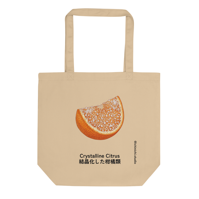 A minimalist eco tote bag featuring a cross hatch colored pencil illustration of a vibrant sugared orange slice.