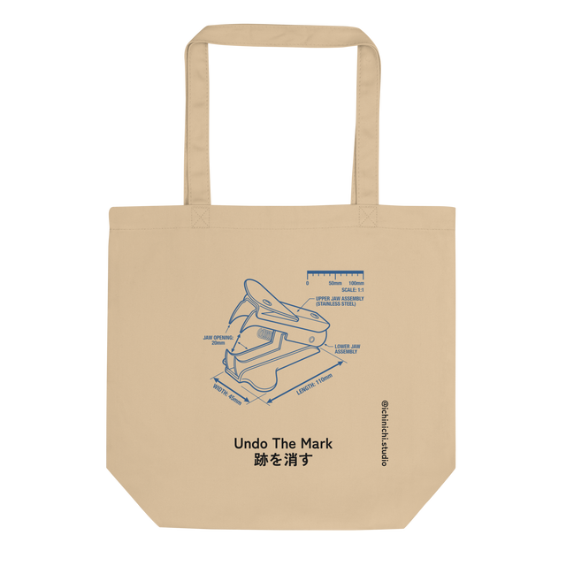 A blueprint illustration of a staple remover on an eco tote bag.
