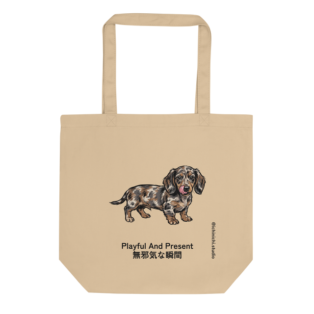 Eco Tote Bag featuring a brush pen illustration of a dapple Dachshund puppy with its tongue out.