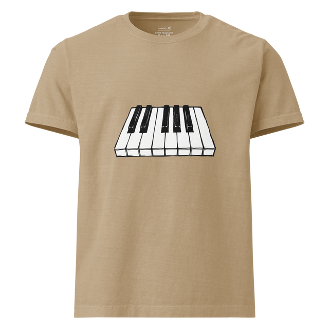 A high-contrast marker illustration of multiple black and white piano keys floating on a white oversized t-shirt.