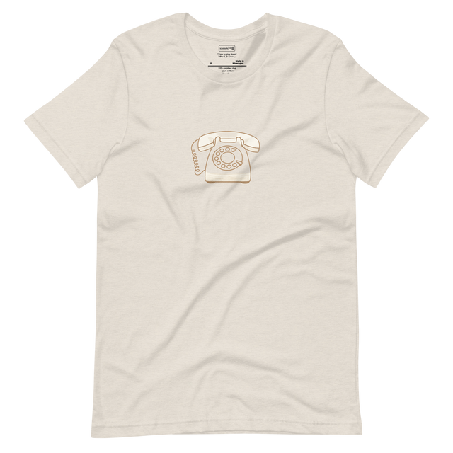 Hand-drawn rotary phone with minimalist vintage style on a neutral t-shirt.

