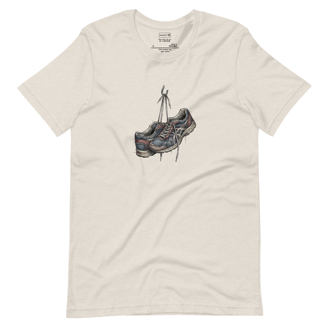 Line art illustration of worn-out running sneakers hanging by their laces on a hook on a white T-Shirt.