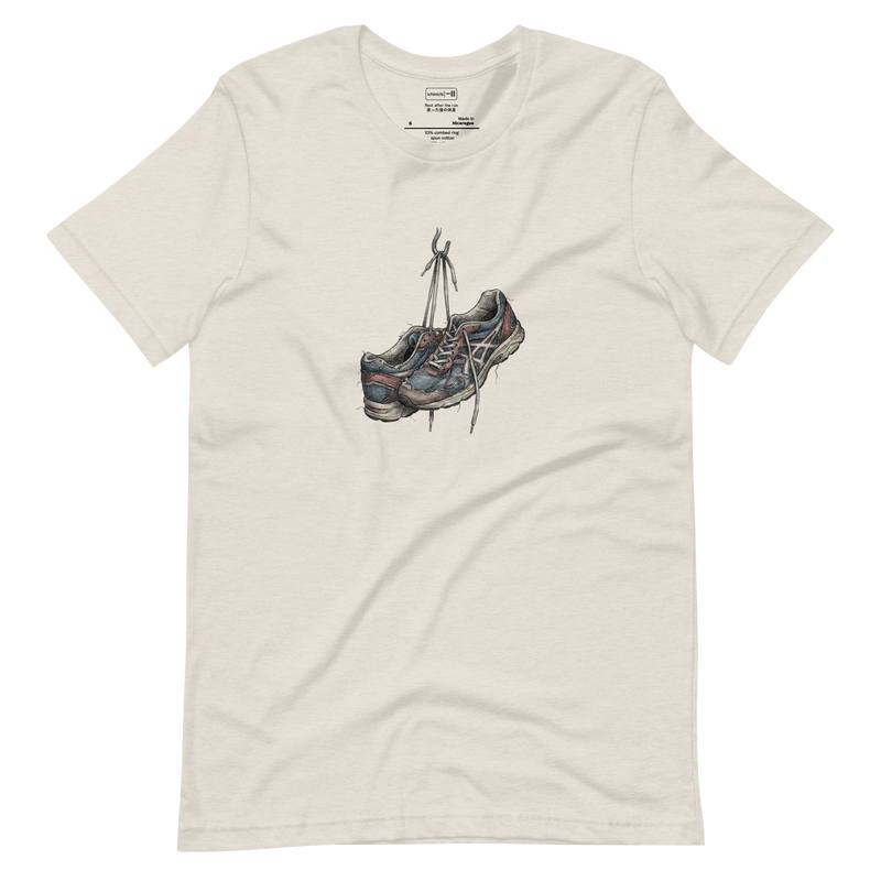 Line art illustration of worn-out running sneakers hanging by their laces on a hook on a white T-Shirt.