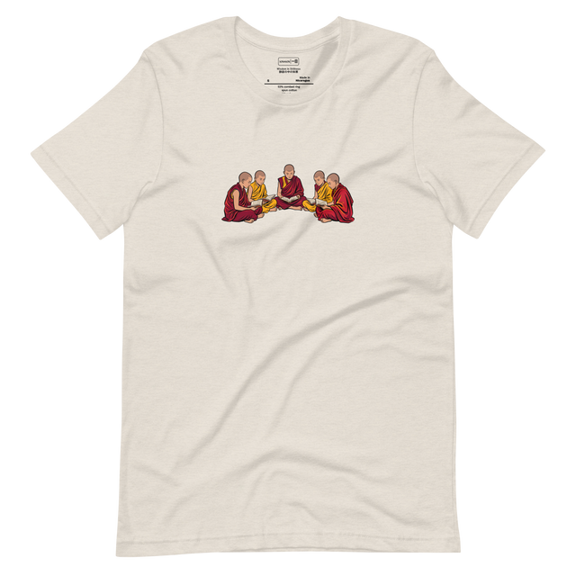 Short Sleeve T-Shirt featuring a clean brush illustration of young monks in deep red and yellow robes sitting on the ground reading books.