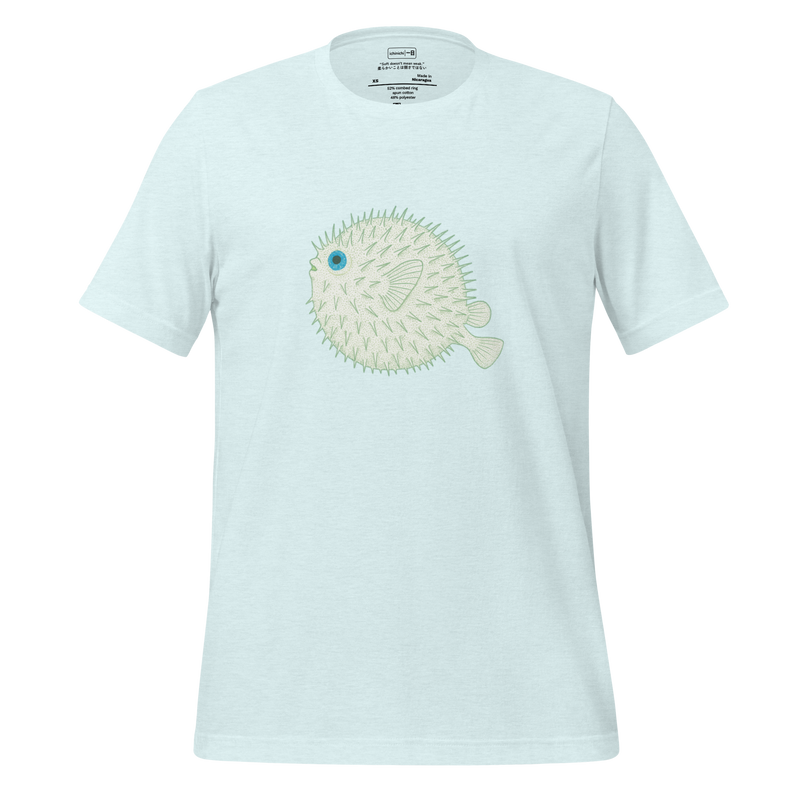 Stippled green illustration of a pufferfish with bright blue eyes, minimalist and softly textured.