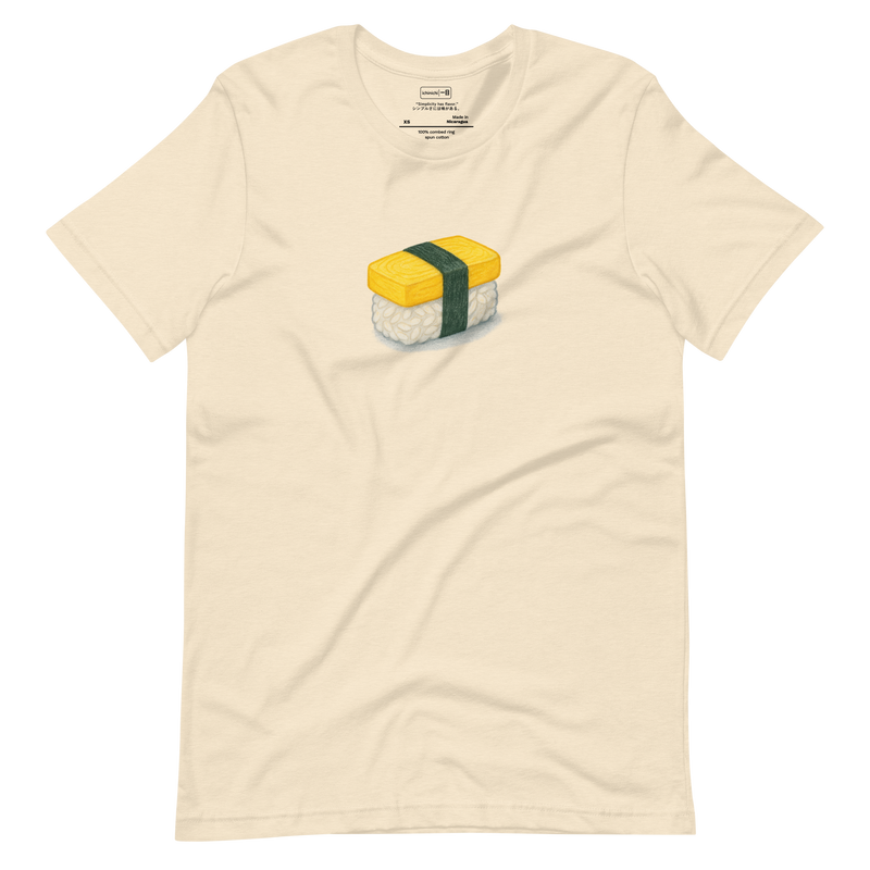 Minimalist T-Shirt design featuring a tamago sushi piece wrapped with a strip of dark green nori.
